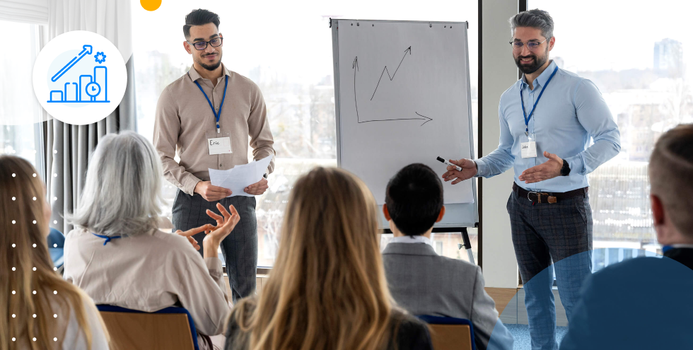 Presentadores explicando gráficos de crecimiento en una empresa