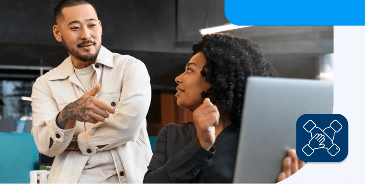 Coworkers collaborating and communicating in English.