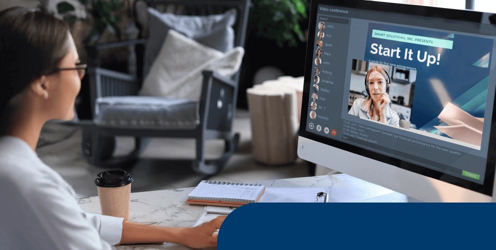Professional attending a virtual presentation in English from their desk, representing effective communication in hybrid work environments. 