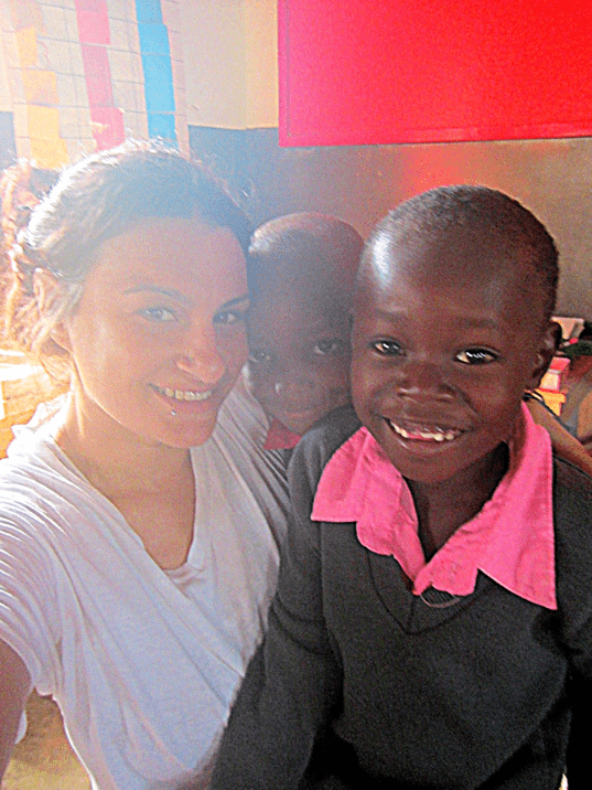 Lindsay with 2 of her ESL students in Tanzania 