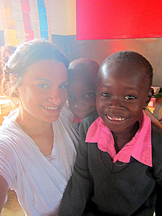 Lindsay with 2 of her ESL students in Tanzania 