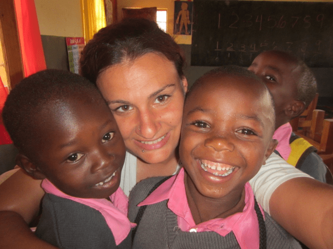Lindsay posing with her ESL students in Tanzania 