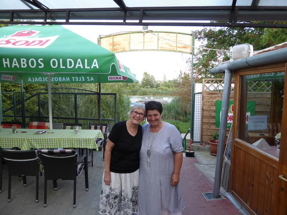 CETP American director Mary Rose and Hungarian director Hajni Vancsik at restaurant on the little Danube in small city of Szigetszentmiklos