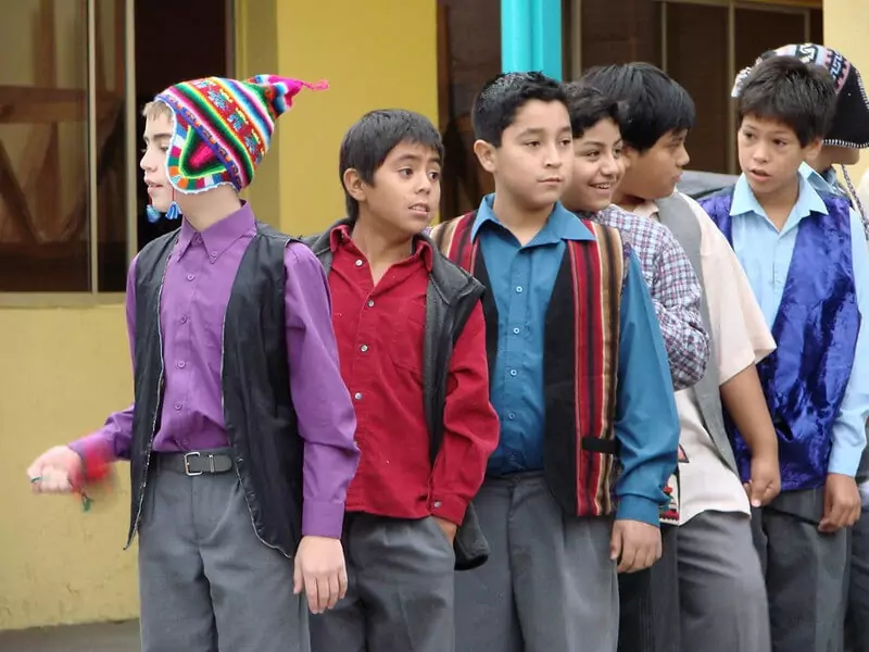 Students lined up to perform an ESL activity outside the classroom.
