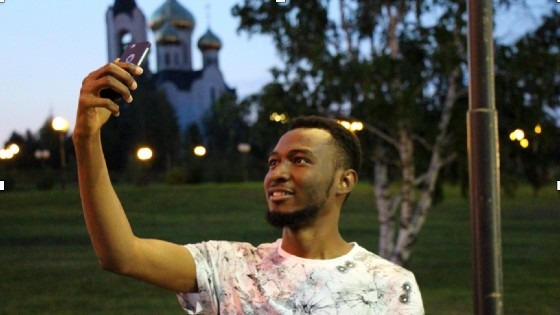 Tariq Adams, teacher in Russia, taking a selfie in his favorite park