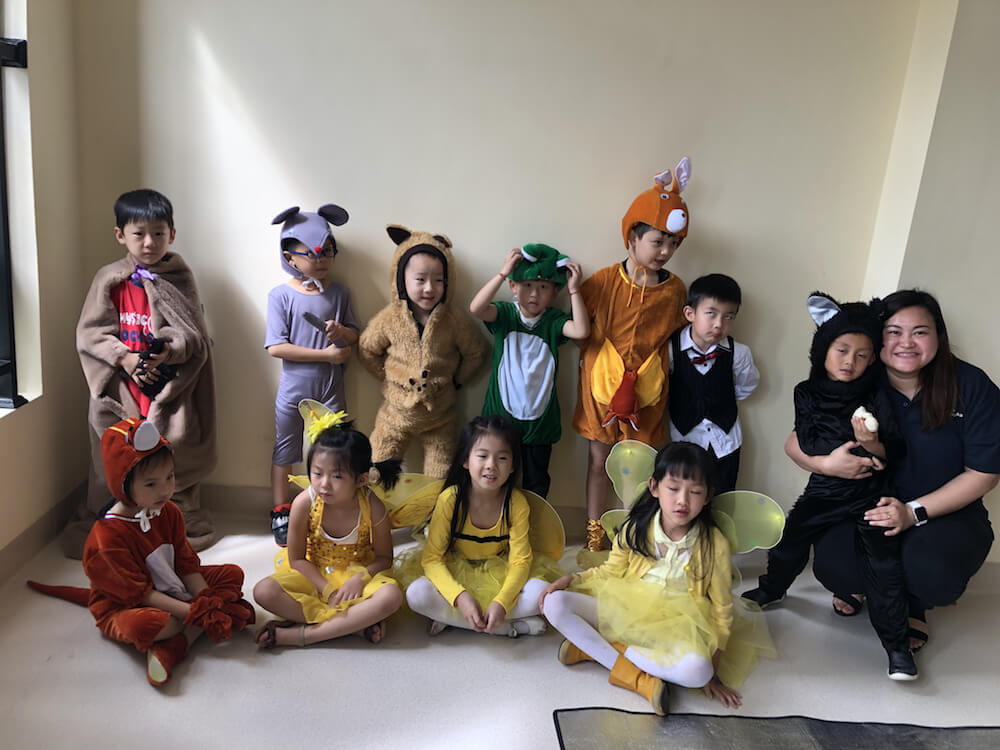 Shella Chua, Filipino Teacher in China with students in costumes