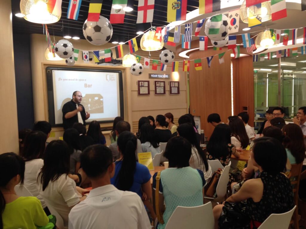 Teacher Shawn presenting one of his powerpoint series in front of students