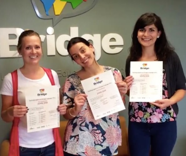 teachers holding their tefl certificates