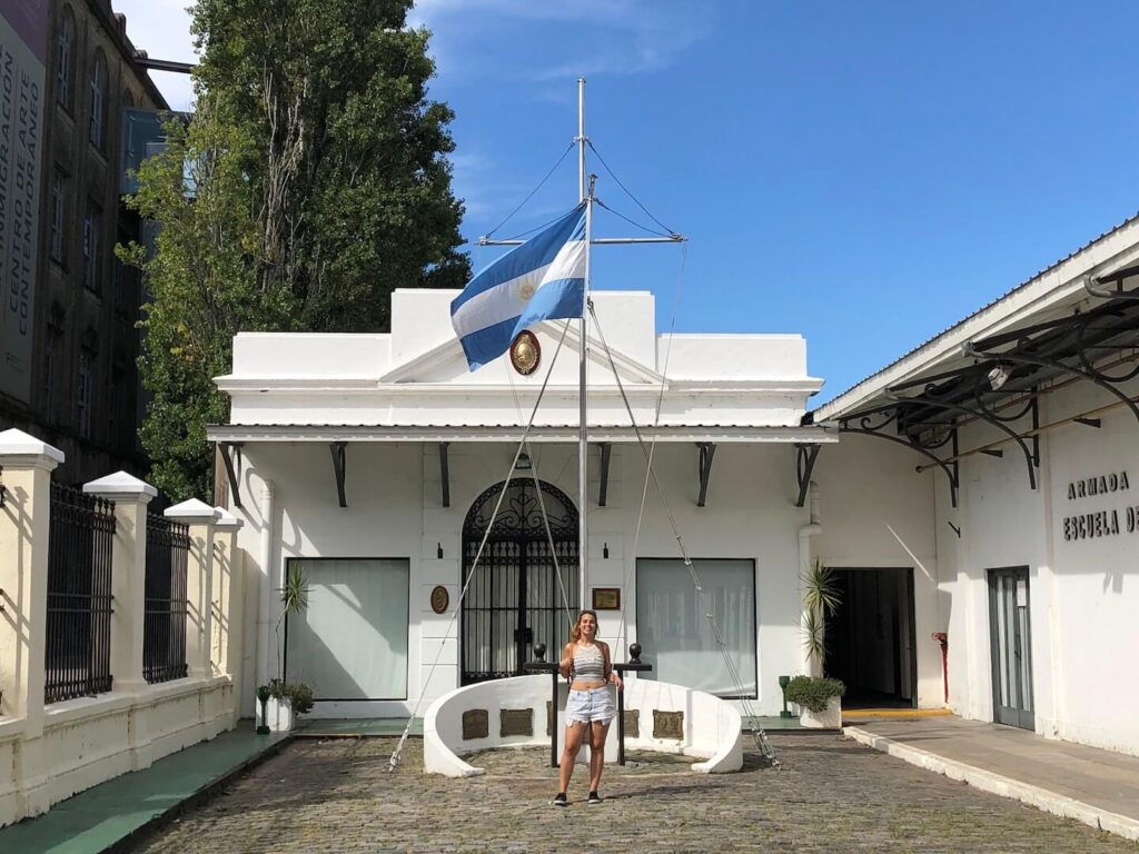 teacher in front of Argentina flag