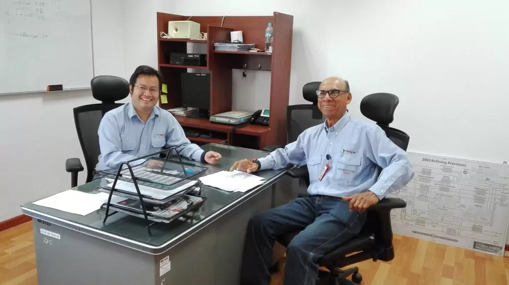 Niels (left) working at his office