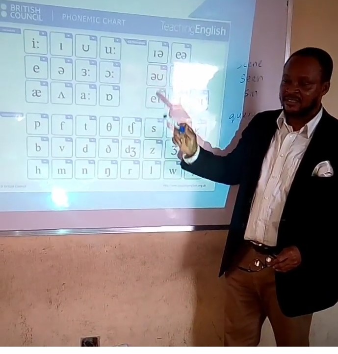 Phonics teacher Uchechukwu, from Nigeria, teaching the phonemic chart