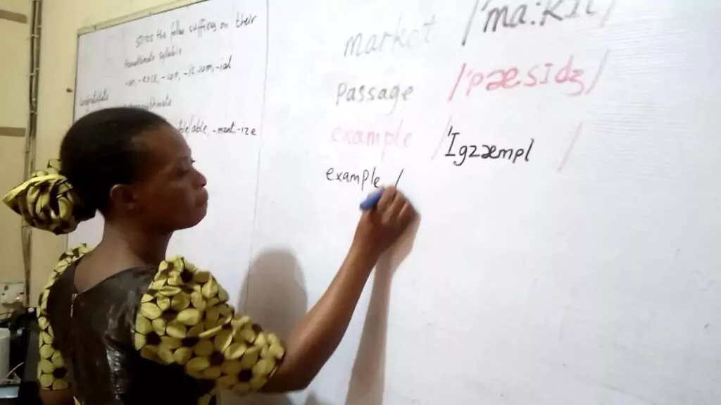 An ESL teacher during a phonics training activity