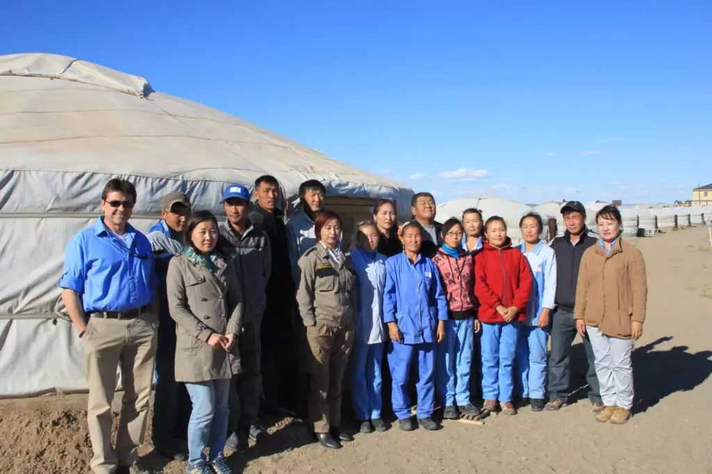 Mark (first on the left) with his Mongolian team at a camp in the Gobi Desert
