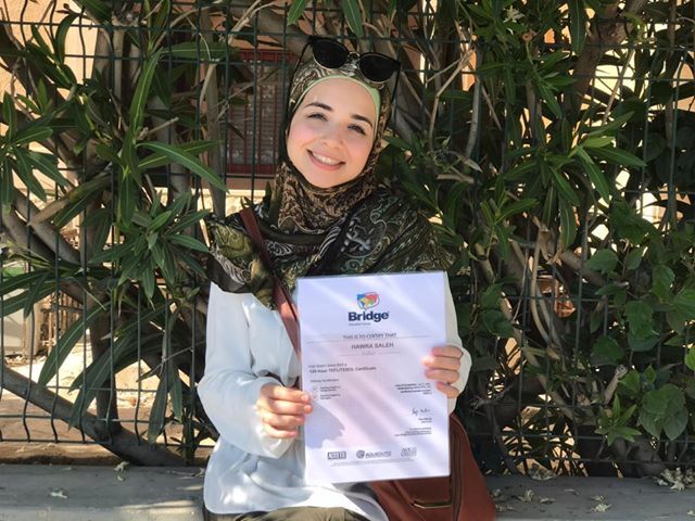 Teacher Hawra with her completed TEFL certification from Bridge.