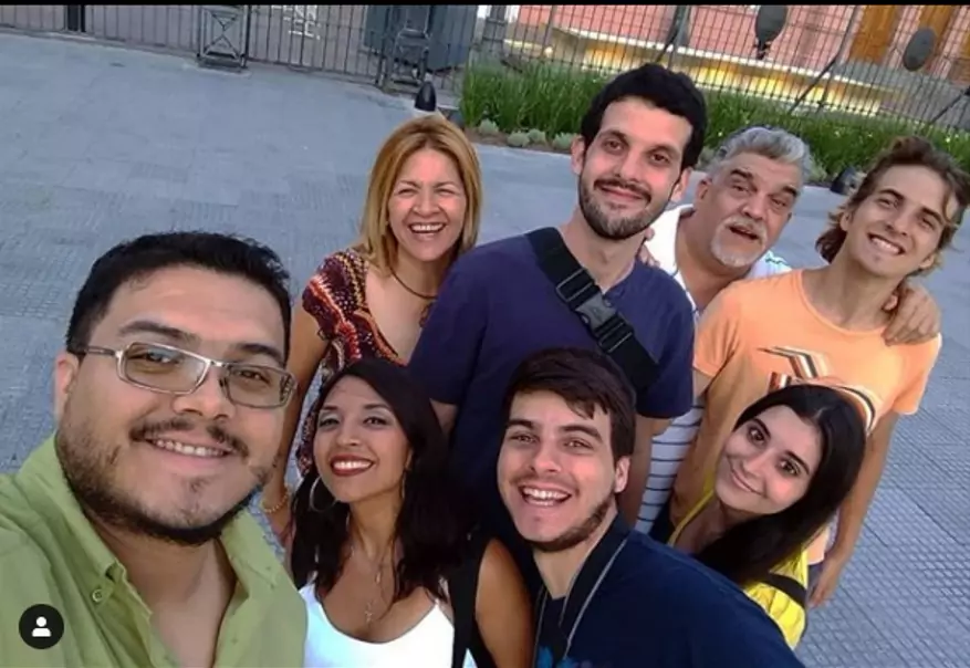 Alejandro (center) with his family during their visit to Argentina