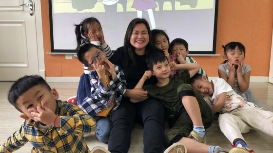 Shella with her former students in China