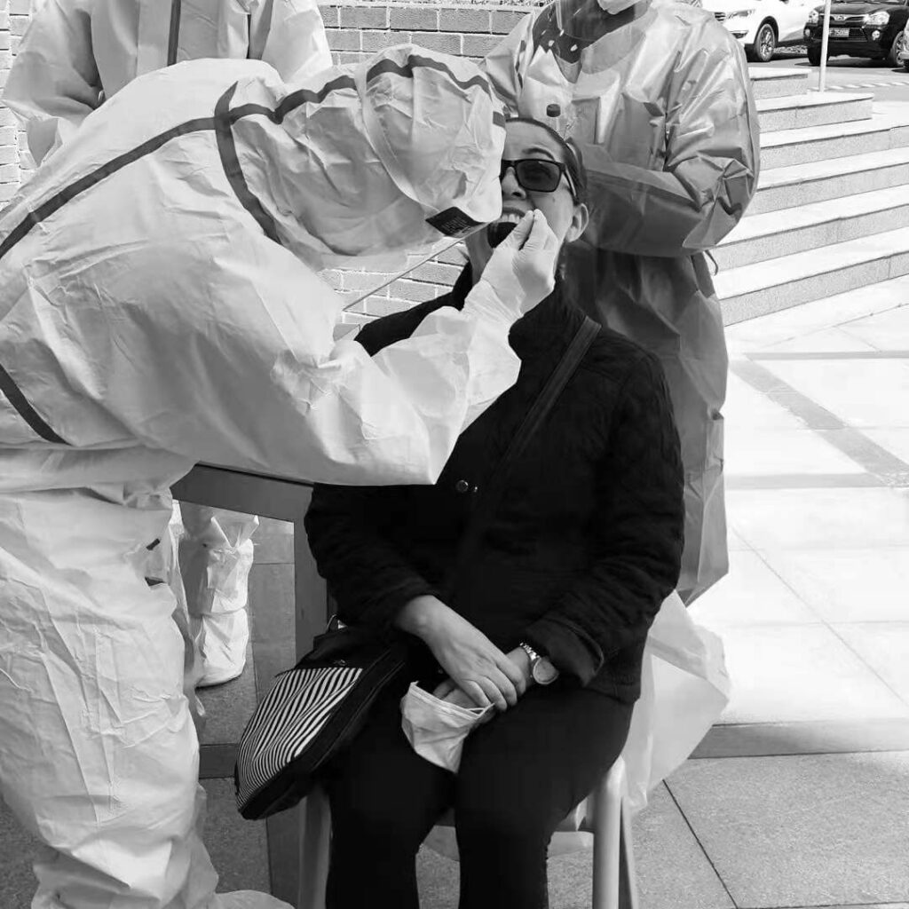 Carolina taking a COVID-19 test during the onset of the pandemic in China