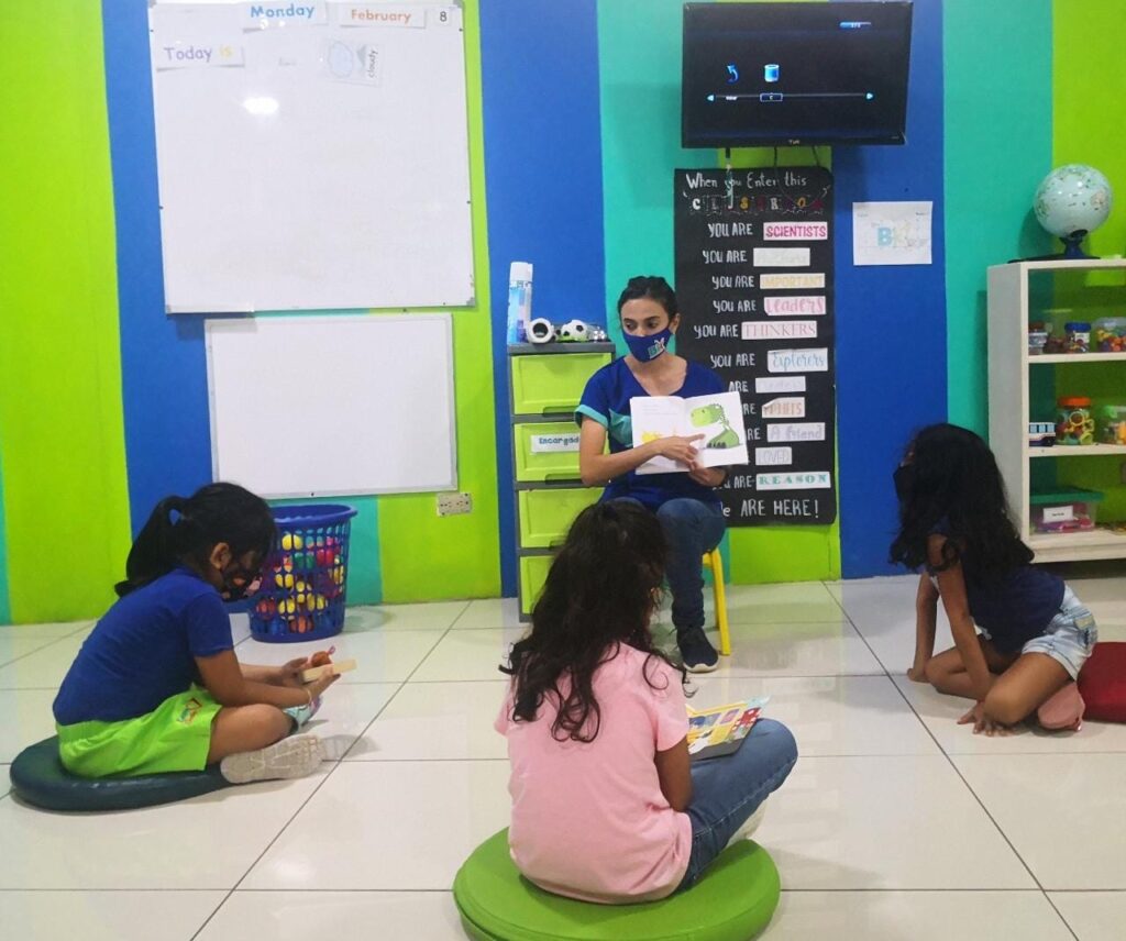 ESL teacher reading to young learners