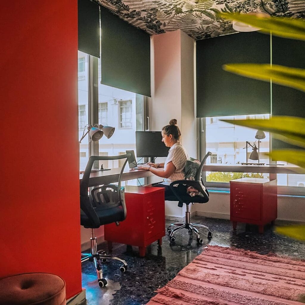 a digital nomad teacher named Margarida working in a co-working space in Athens, Greece.