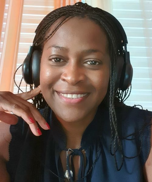 An image of Deborah, a Bridge TEFL graduate and teacherpreneur from Switzerland, smiling at the camera