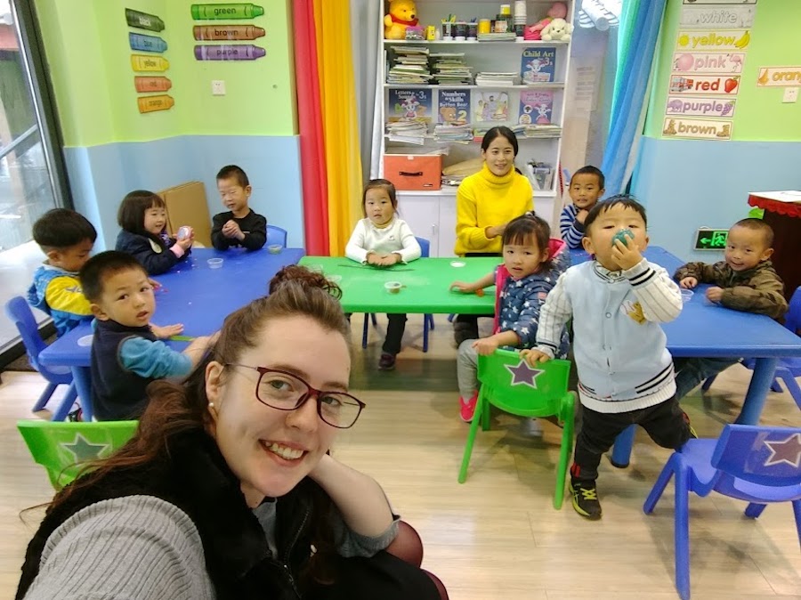 Female ESL teacher in young student classroom