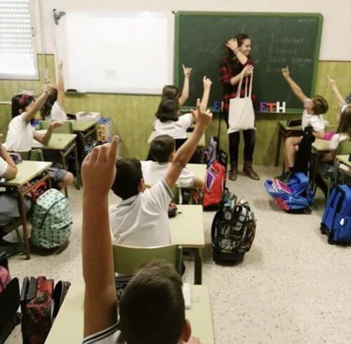 Elizabeth and her students during a class activity.