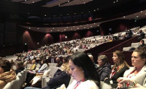 audience members listen to an IATEFL speaker.