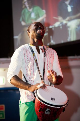 English teacher Shane playing a drum.