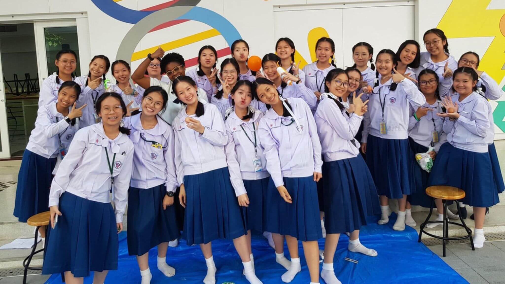Students in Thailand posING for a picture.