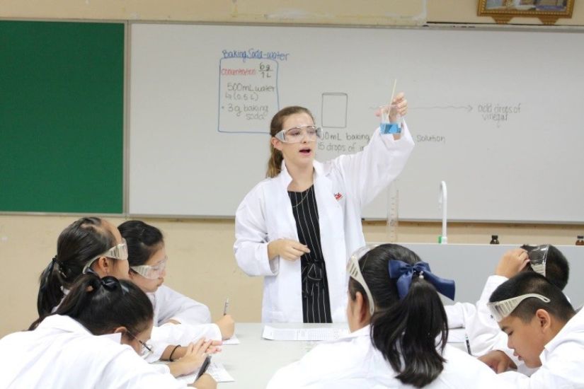 a BFITS teacher teaching a science class in English.