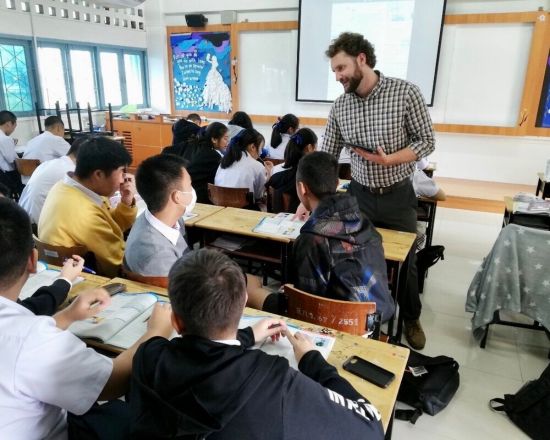 a BFITS teacher interacting with students in the classroom.