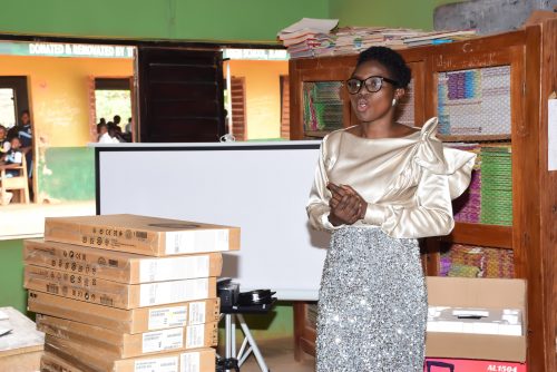 Bridge alum, Oluyemisi standing in her classroom