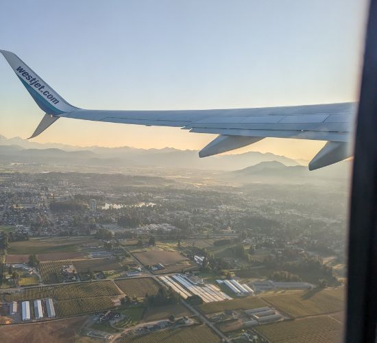 Canada landscape from a window seat on an airplane.