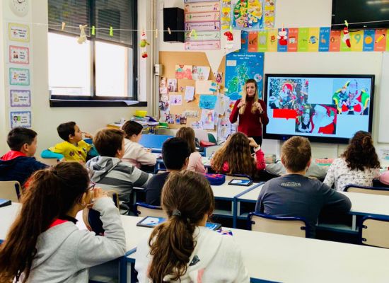 an English teacher standing in front of her students in Spain