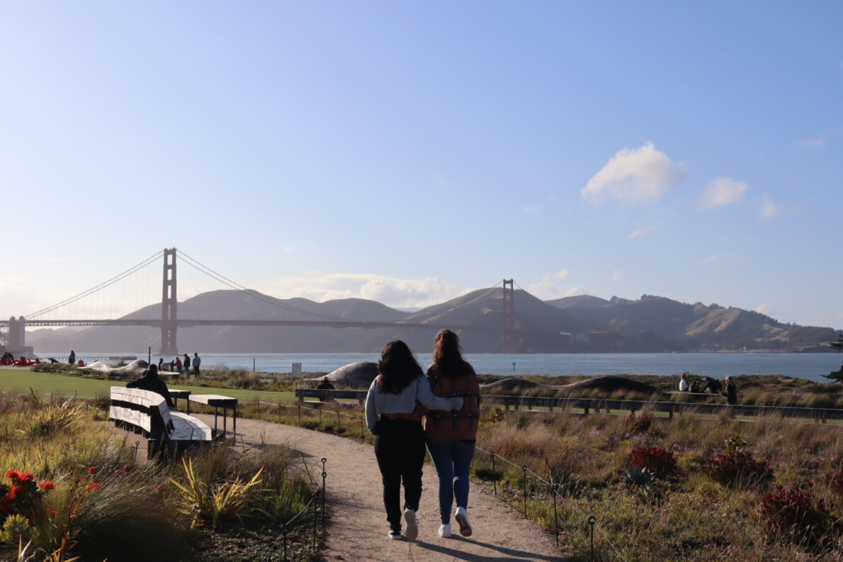 Indiana walking a trail by the Golden Gate Bridge in San Francisco