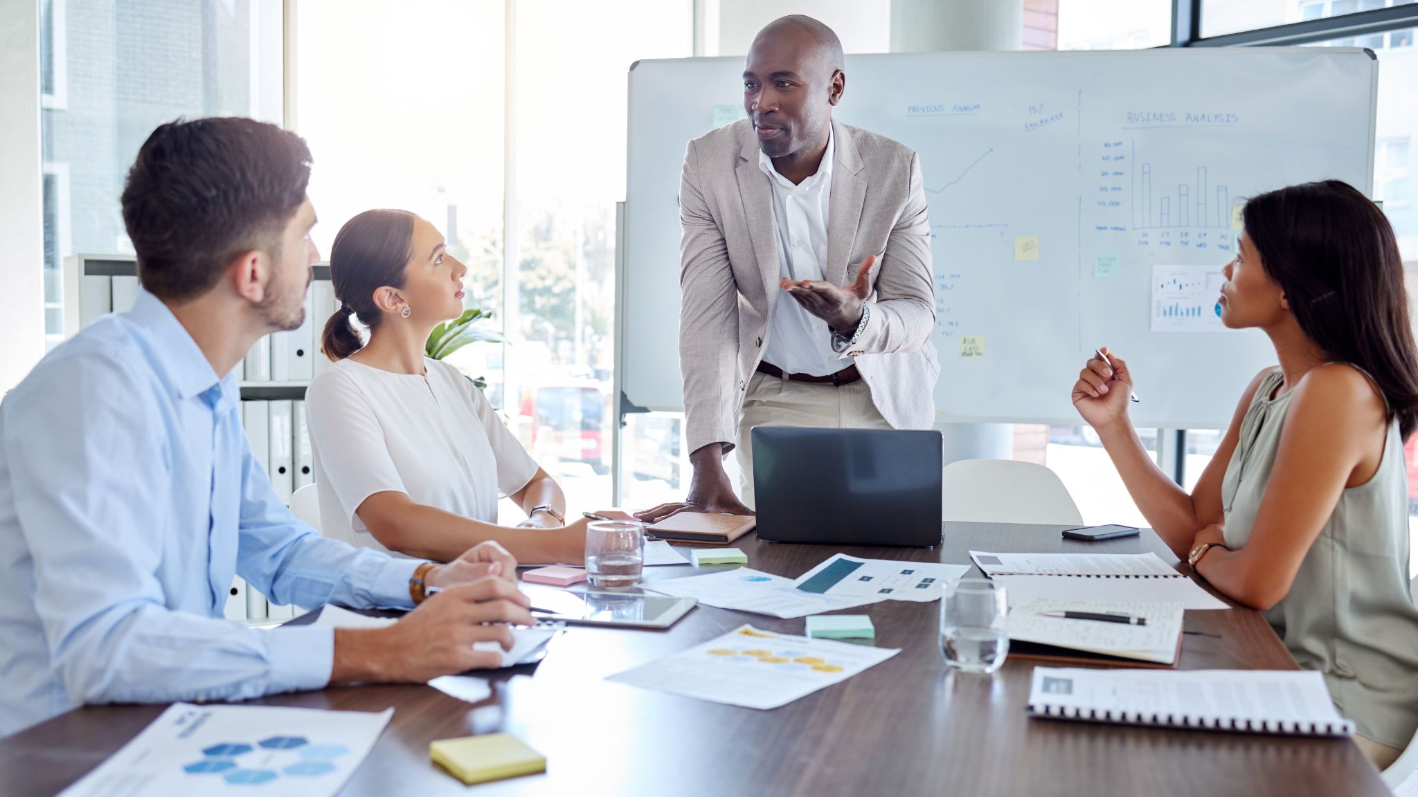 a man presenting in a business meeting