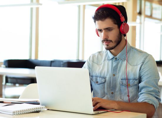 a man completing language lessons on his laptop