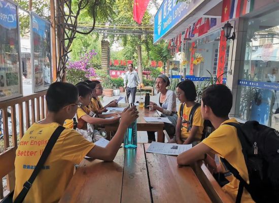 An image of an English teacher teaching teens at an ESL camp in China