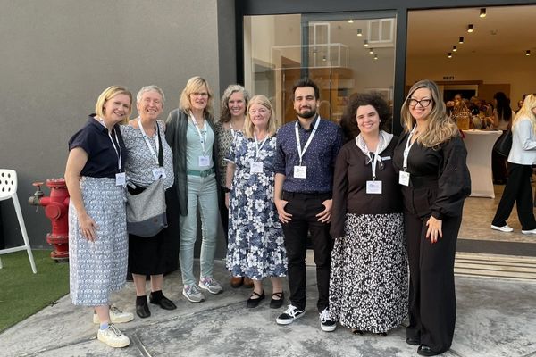 A group photo of Bridge teacher Umut Ergoz and the IATEFL BESIG committee at the 2024 IATEFL BESIG Annual Conference in Malta.