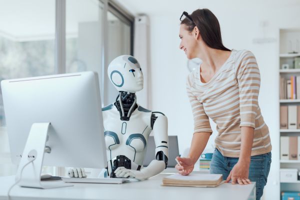 An image of a human woman working together with an AI robot 