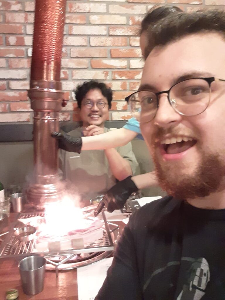 An image of Hunter, a Bridge graduate, eating Korean BBQ