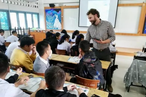 An image of a BFITS teacher in the classroom talking to his students.