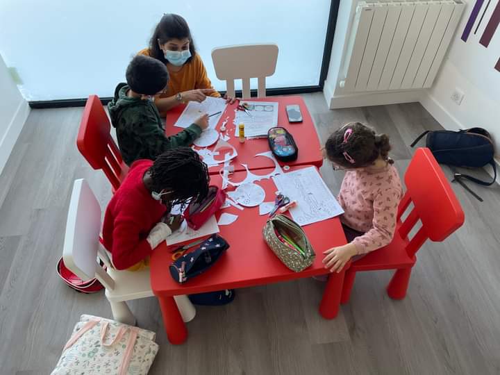 An image of Suchismita teaching English in France to young learners