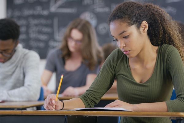 An image of ESL students taking a traditional English proficiency exam