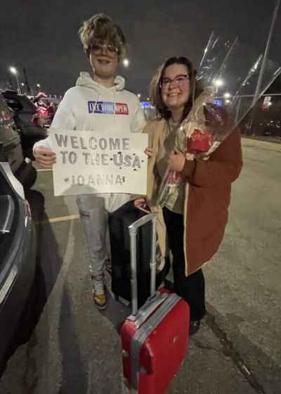 Joanna is received by one of the members of her au pair family in Illinois.