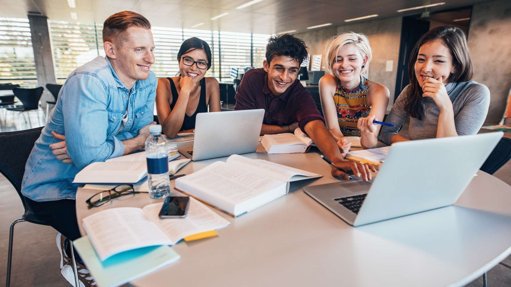 Students doing group work together at university.