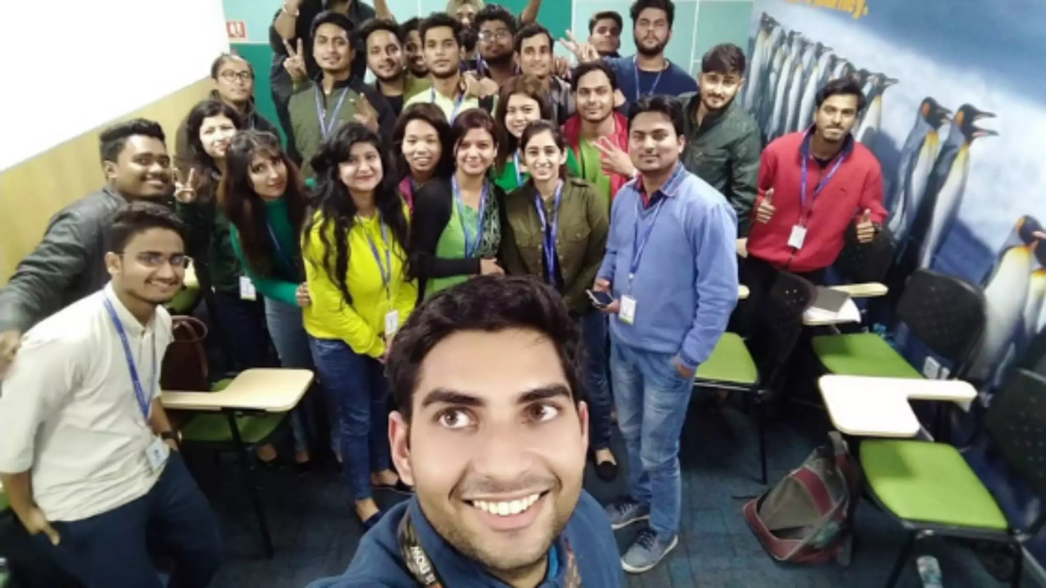 Teacher with a group of adult students in a classroom
