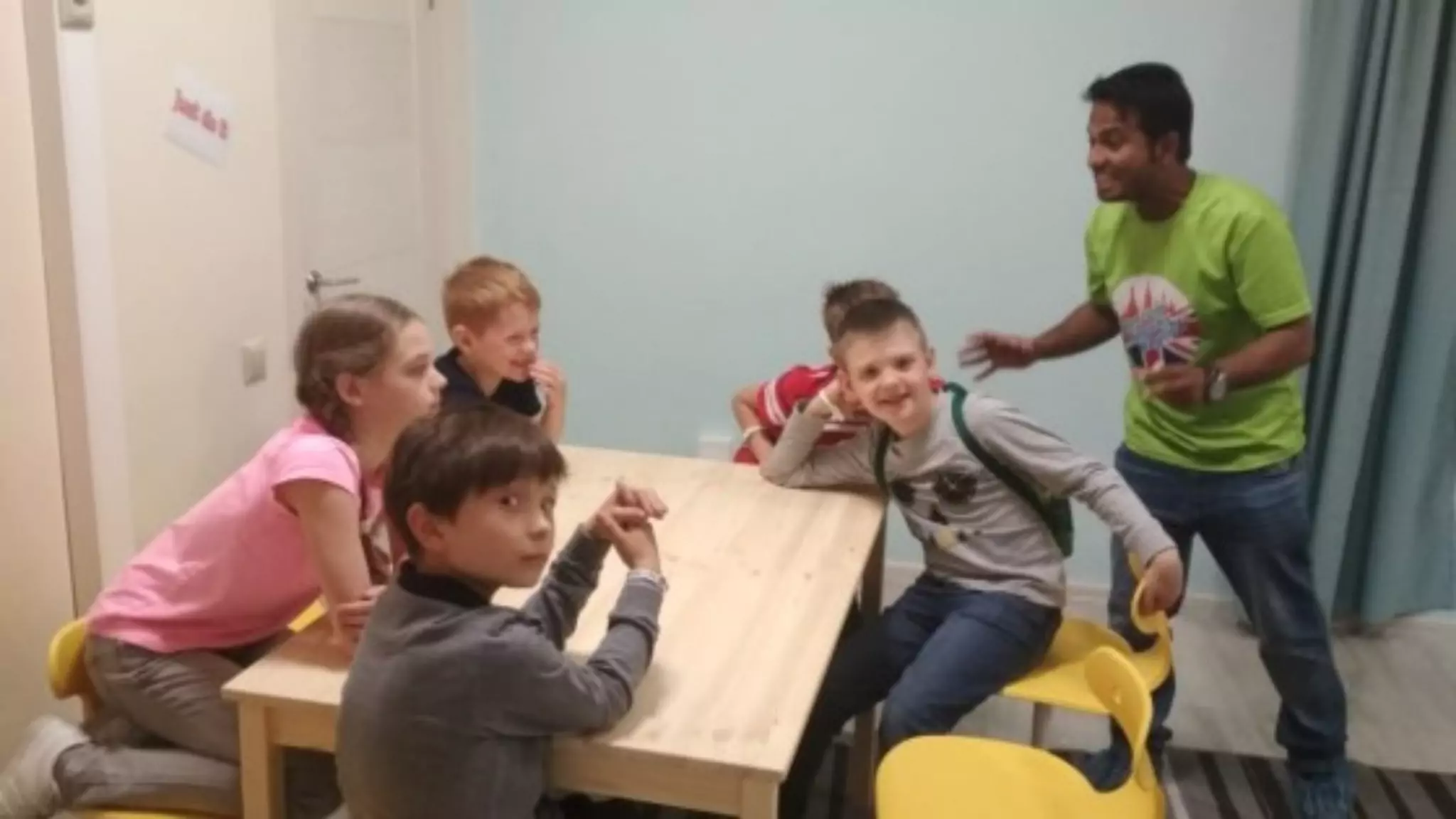 Teacher with students during a no-prep ESL activity