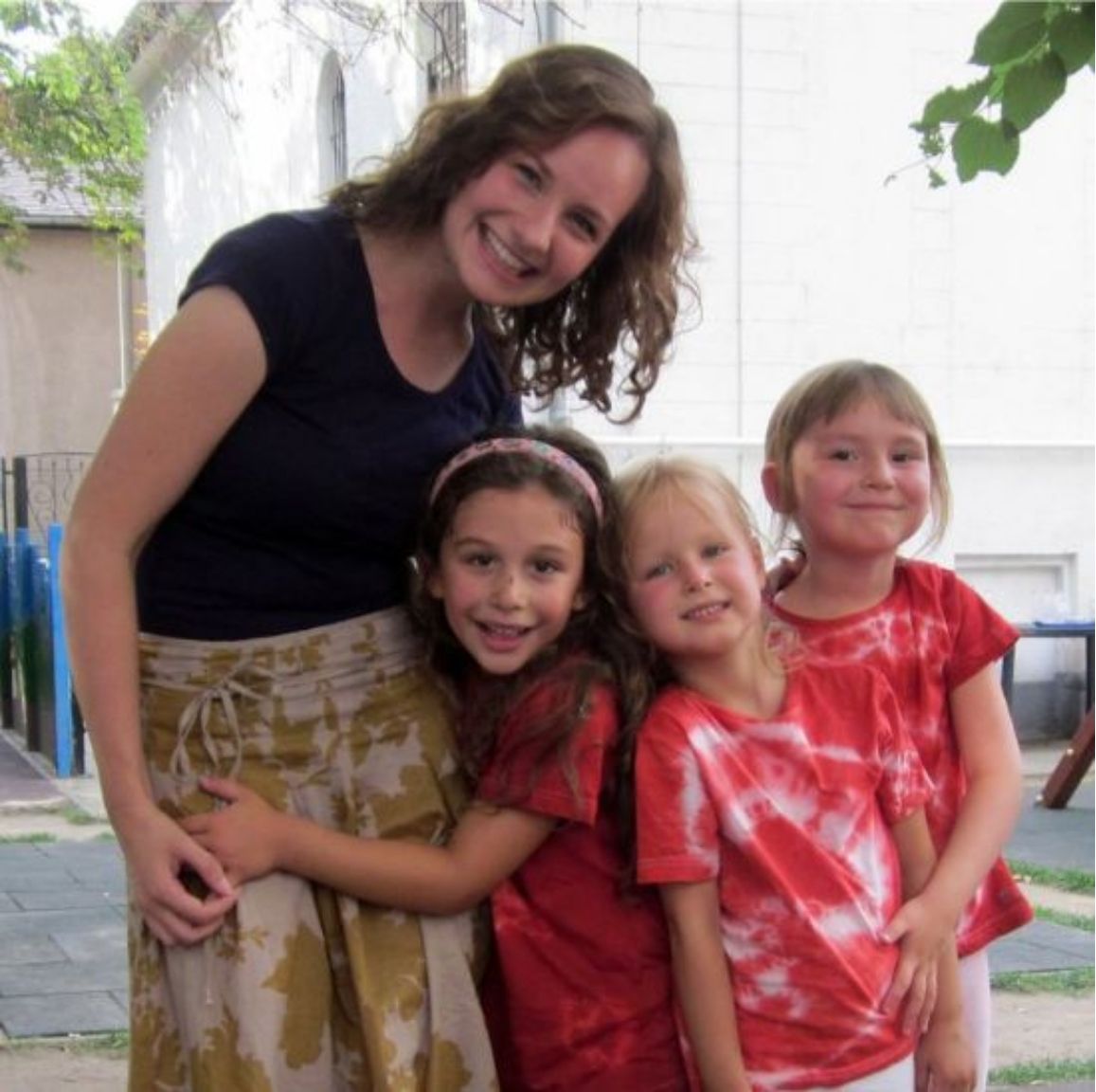 An au pair with three of the host family's children.