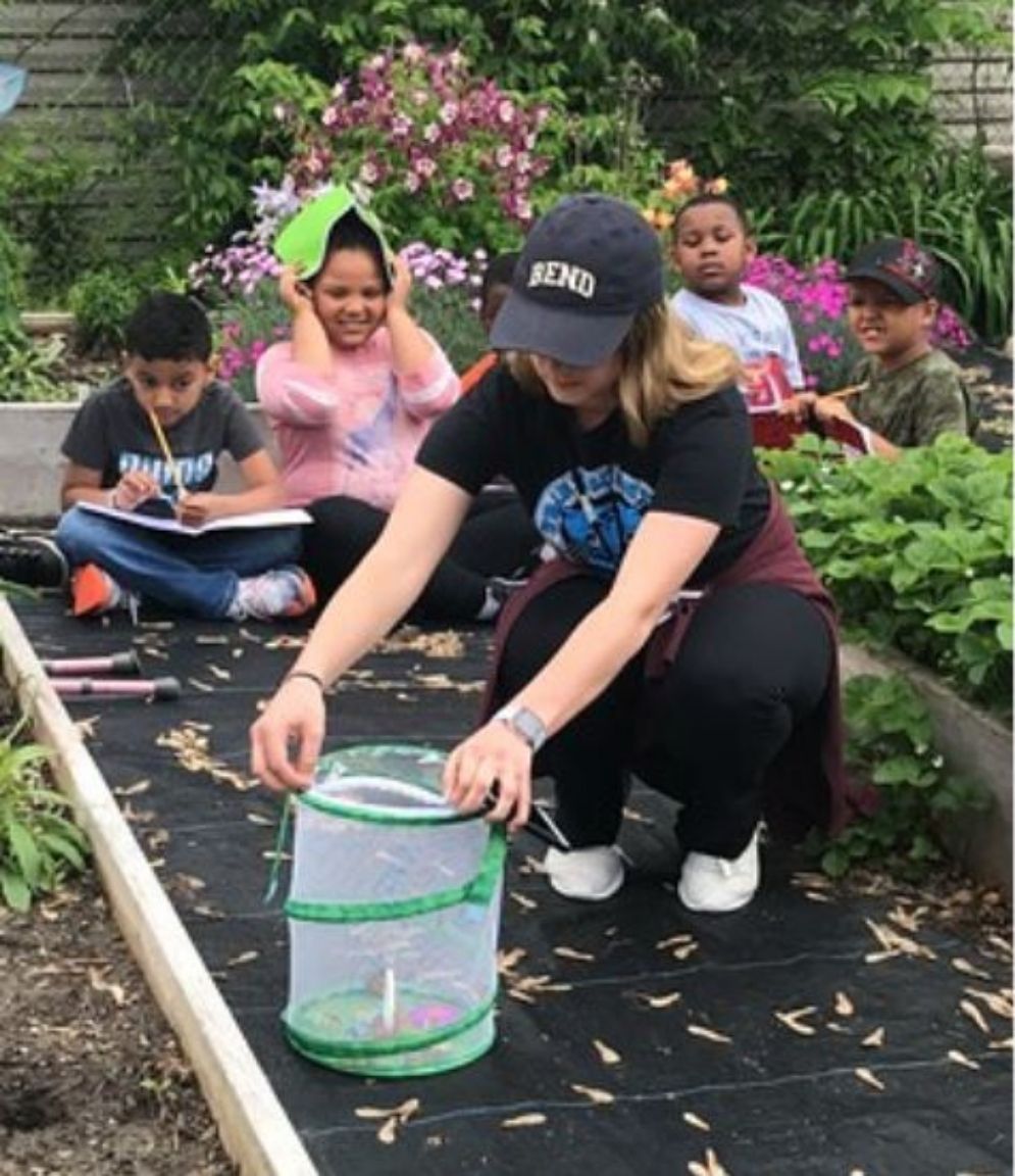 An au pair doing some outdoor activities with her host family.